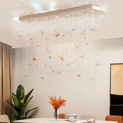 Crystal butterfly pendant chandelier hanging above a dining table setting