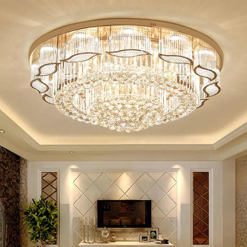 Chandelier hanging in a room with a television and decorative elements.