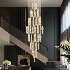 Crystal stair pendant lighting for upscale home entryway spaces