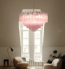 Polished steel fixture with customizable glass shades in a European-inspired interior