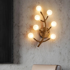 Sculptural wall light fixture with multiple globes for corridor lighting