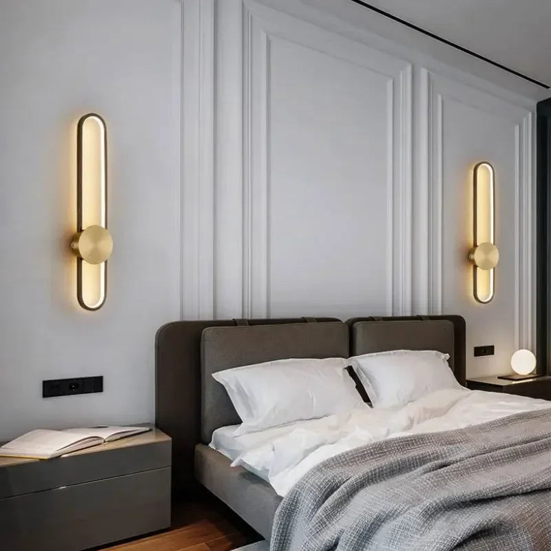 Modern bedroom with a bed, nightstands, and wall sconces.