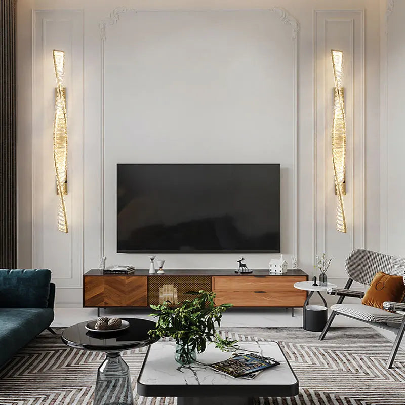 Modern living room with a television, wooden cabinet, and decorative items.