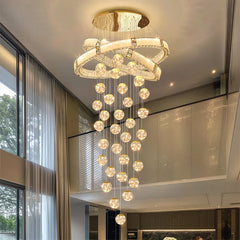 Liglite dimmable LED pendant light hanging in high ceiling foyer