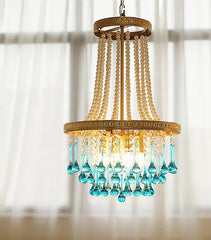 Vintage chandelier with blue glass accents in classic dining room