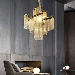 “Gold and silver chandelier with tiered crystal look for foyer and lounge lighting.”