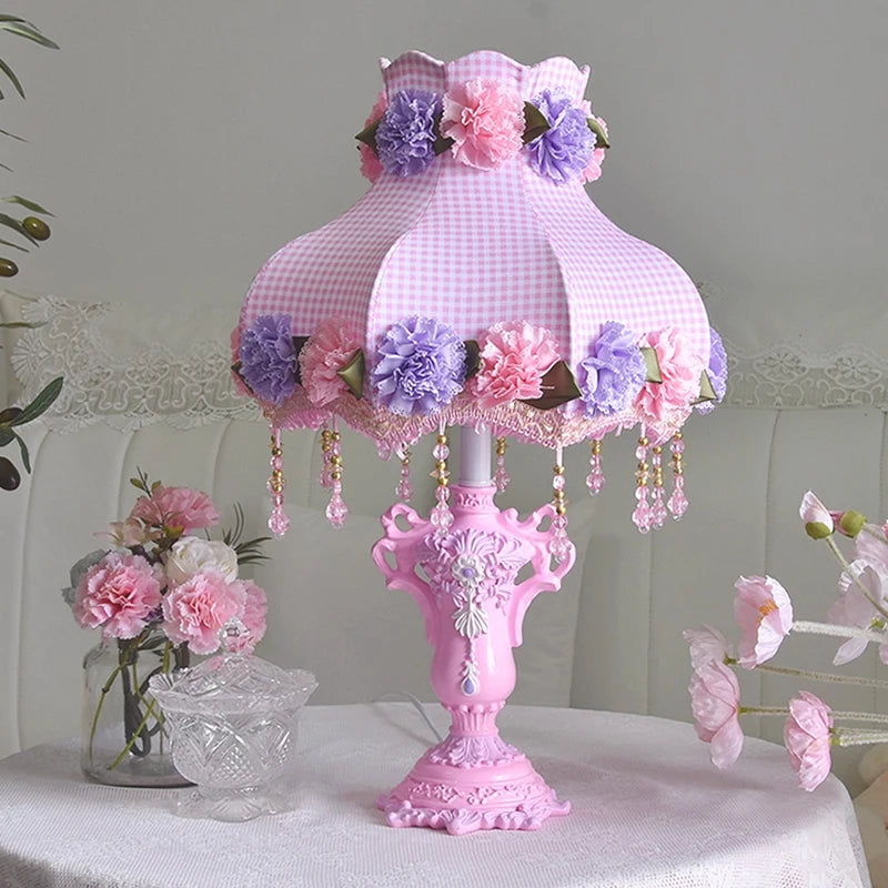 “European pink flower table lamp with beaded floral shade and resin base”

