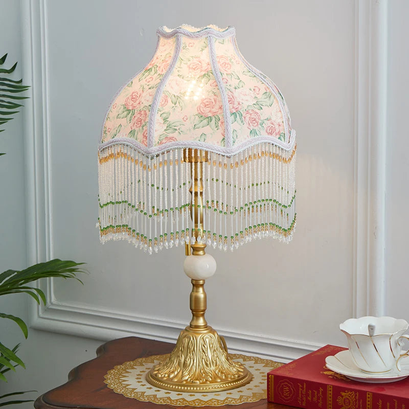 “European retro desk lamp with alloy base and floral fabric tassel shade”