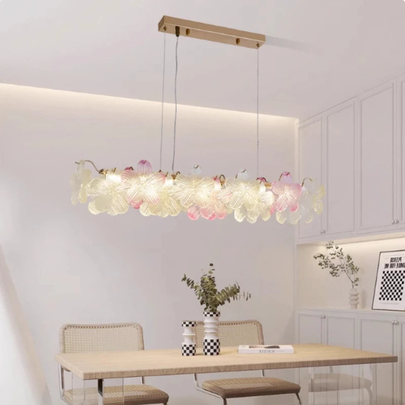 Modern dining room with a floral pendant light fixture.