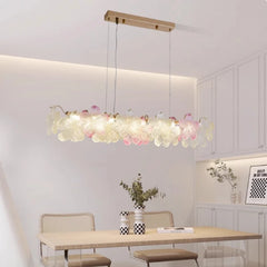 Modern dining room with a floral pendant light fixture.