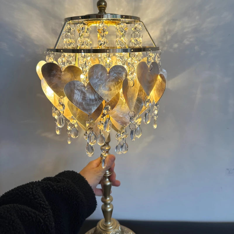 “French luxury heart crystal table lamp with golden iron and shell decor”