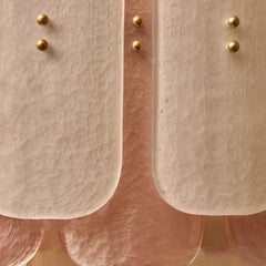 Close-up of a metallic surface with gold knobs