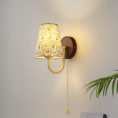 Wall-mounted lamp with floral shade on a neutral wall . Colorful flower cloth wall light for bathroom, kitchen, or stairs.