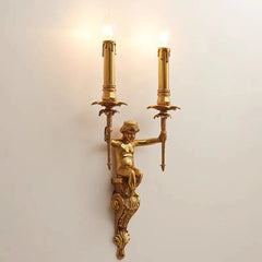 Gold wall sconce with classical design on a light background