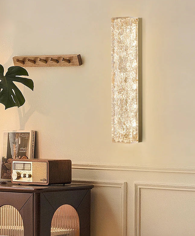 Wall mounted glass and crystal sconce for foyer or hallway lighting