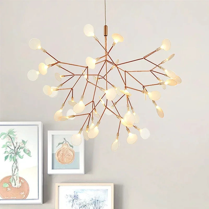 Branch-shaped LED pendant light hanging over a dining area