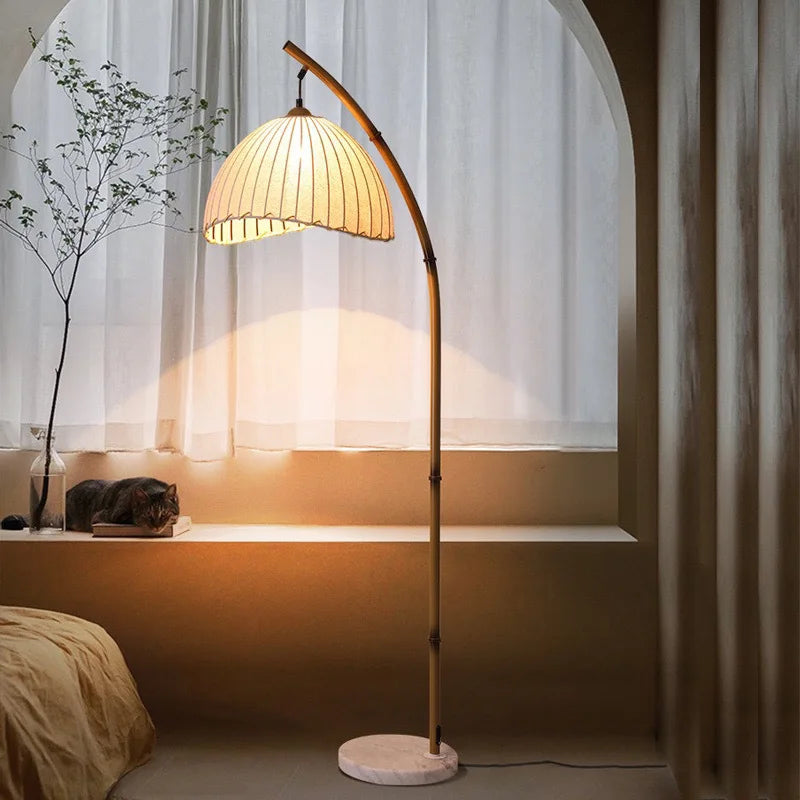 “Handmade bamboo floor lamp with rustic fabric shade”
