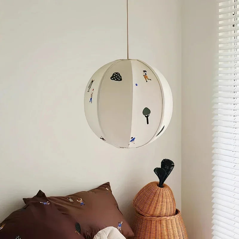 “Simple round cloth pendant, artisanal hand-stitched motif, for bedroom or living room”