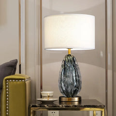 “Hotel bedside glass accent lamp with green marbled base”
