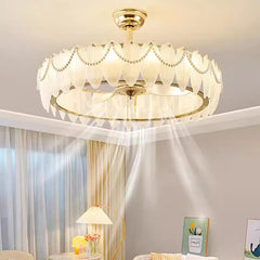 Close-up of polished chrome chandelier fan with feather trim