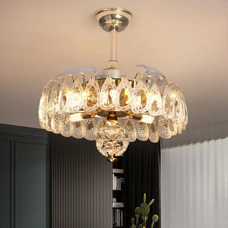 Modern LED crystal fan chandelier illuminating a dining room
