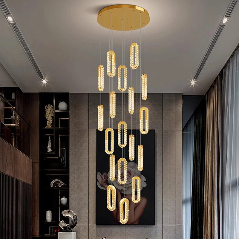 Modern chandelier hanging from a ceiling in a stylish interior setting.