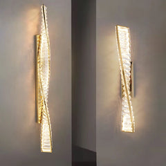 Modern wall sconce with a textured design on a gray wall.
