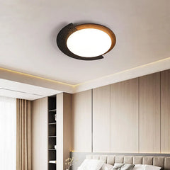 “Minimalist stone ceiling light with warm wood accent mounted on a white ceiling.”