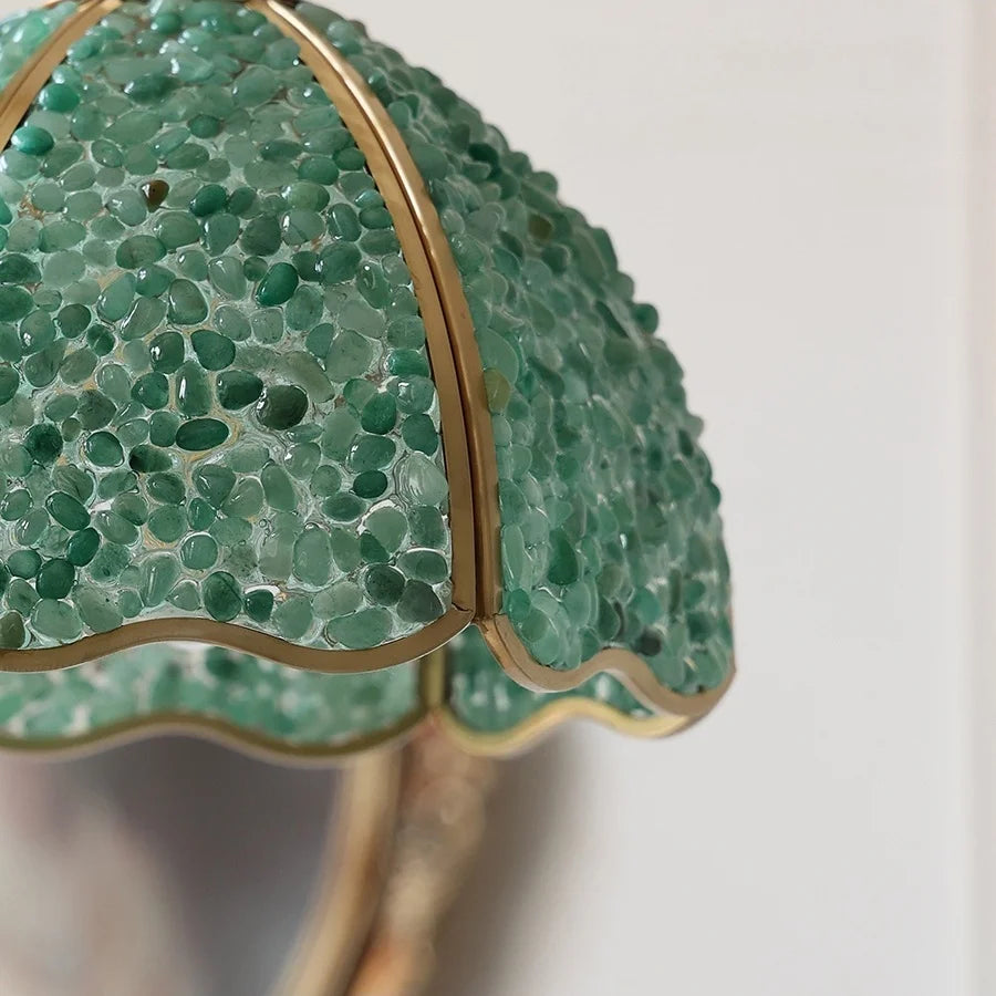 Close-up of a green textured object with gold trim on a white background; Nordic walnut detail pendant, adjustable cord, vintage copper, for bedside or hotel .