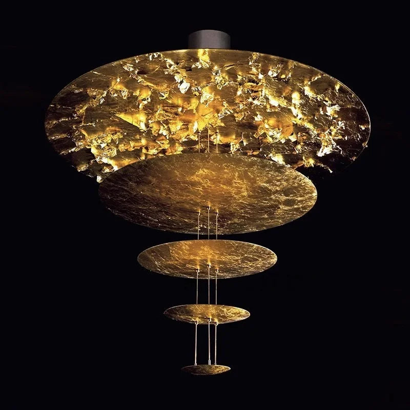 Levitating UFO pendant light with forged metal discs for statement ceiling lighting