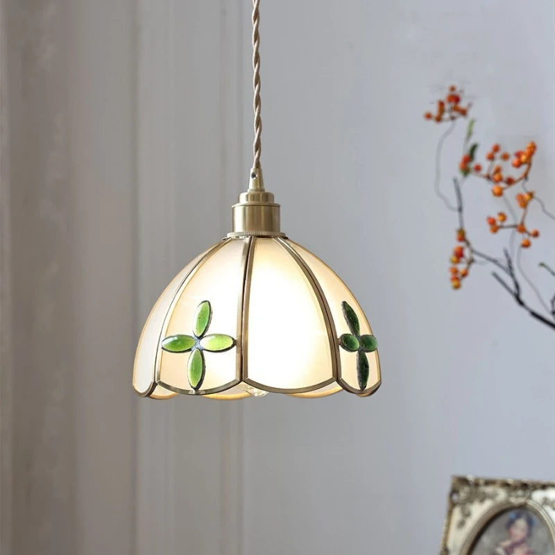 Decorative pendant light with stained glass design on a neutral background. Liglite artisan copper and stained glass pendant for hotels or bars.