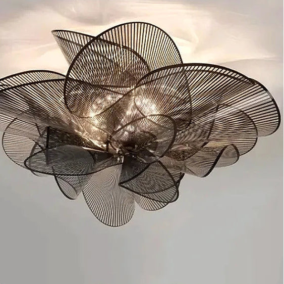 Decorative ceiling light fixture with a floral design on a neutral background