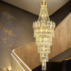 “Rotating gold chandelier with LED bulbs and crystal prisms”