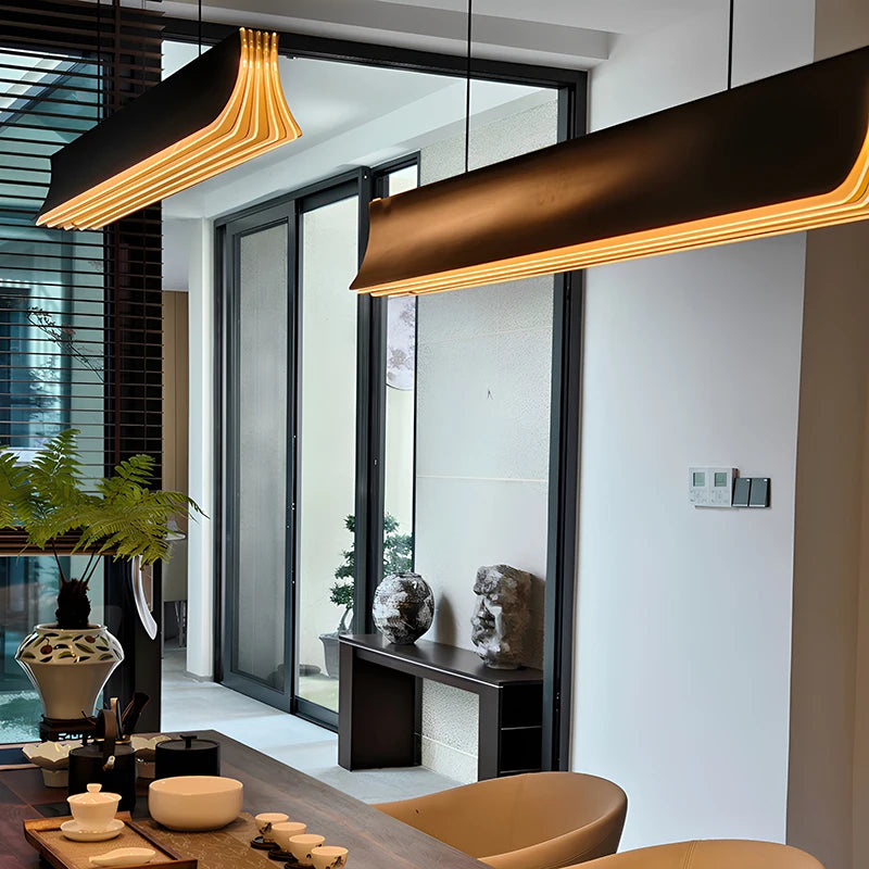 Long linear pendant light with LED bulbs included for kitchen island task lighting