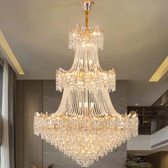 Luxurious crystal chandelier hanging in a room with modern decor.