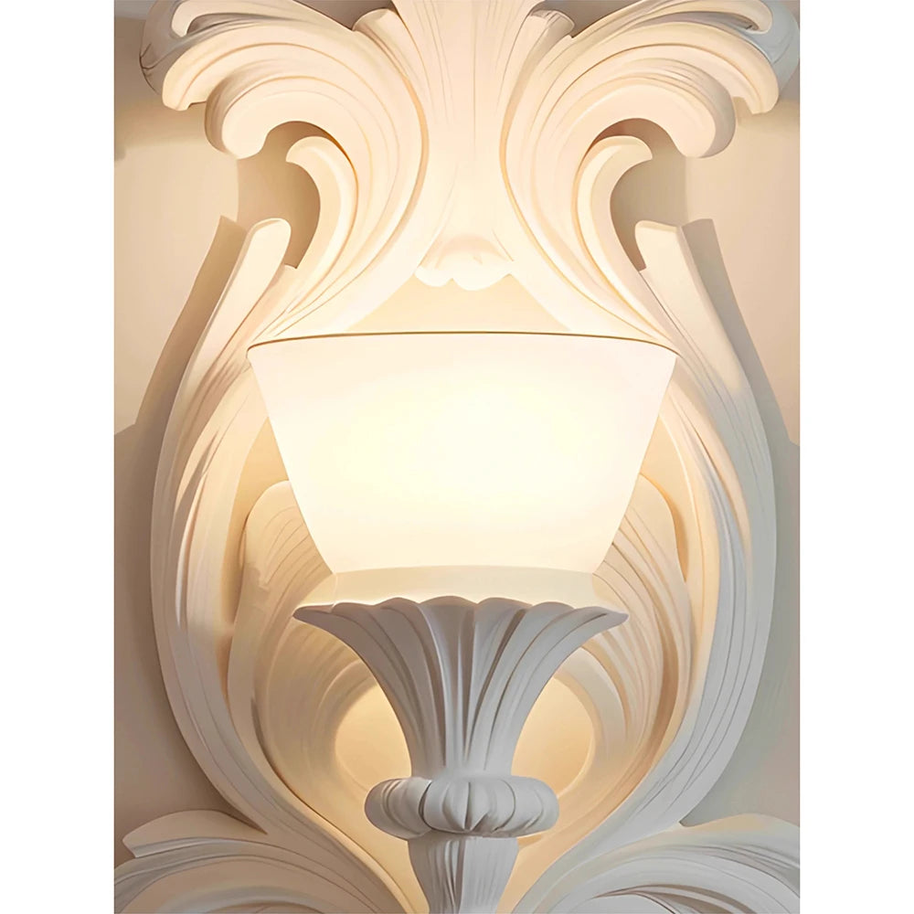 Decorative wall sconce with intricate detailing on a white background