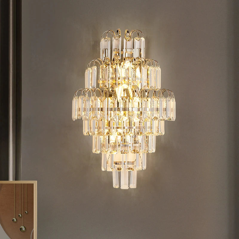 “Luxury crystal wall sconce with gold and clear accents”