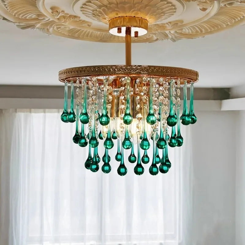 Luxury chandelier featuring green glass drops and LED bulbs