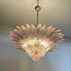Decorative chandelier with a floral design on a plain background
