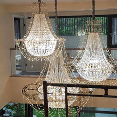 “Luxury draped crystal ceiling lamp with jewelry-inspired chains for grand interiors”