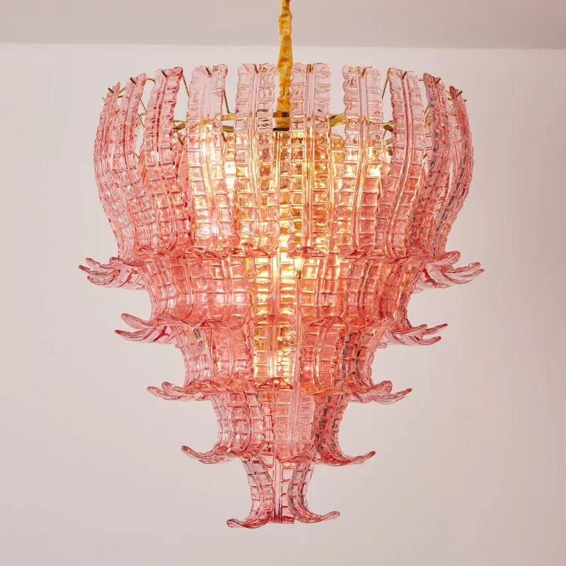 Pink glass chandelier against a plain background