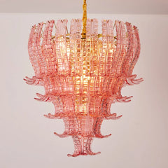 Pink glass chandelier against a plain background