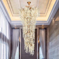 Polished copper chandelier with layered crystal strands for staircases