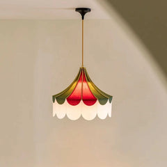 “Color-block fabric pendant lamp with scalloped edge and dark ceiling cord mount.”