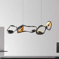 “Modern LED black gold pendant above dining table”