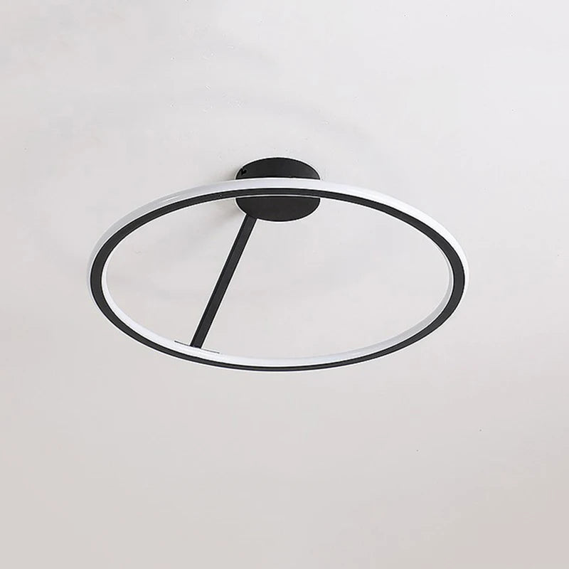 Minimalist circular ceiling fixture designed for bedroom lighting