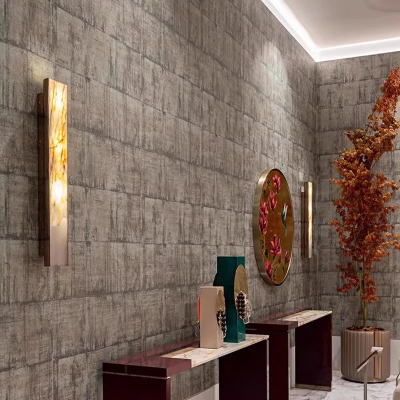 Minimalist wall sconce with marble shade for modern interior lighting