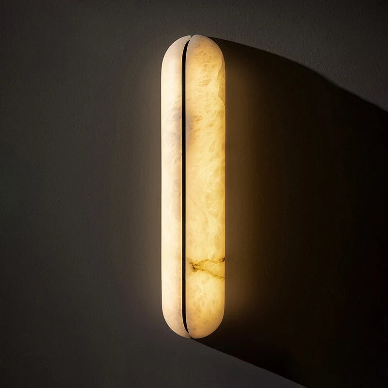 Modern alabaster-style wall sconce mounted for hallway and corridor lighting