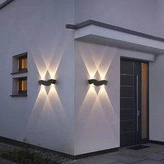 “Contemporary aluminium wall light creating artistic shadows on a wall.”