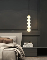 Modern wall light with frosted glass shade for soft diffusion
